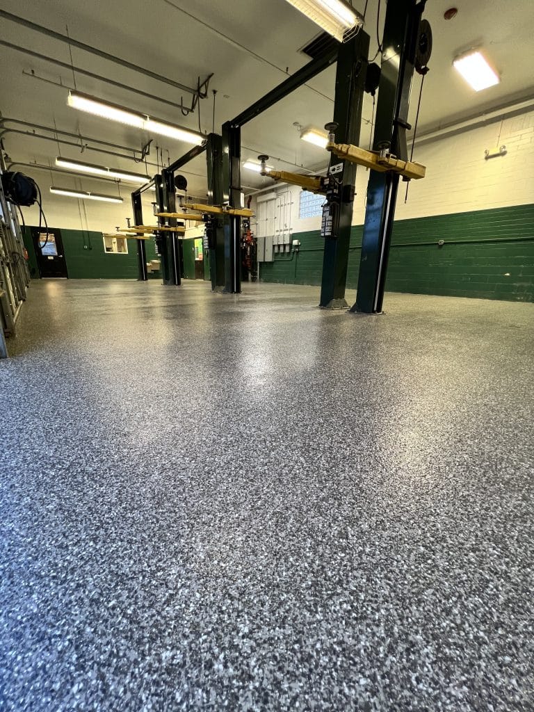 The Ultimate Automotive Shop Flooring Guide: Resisting Oils, Chemicals, and Impacts